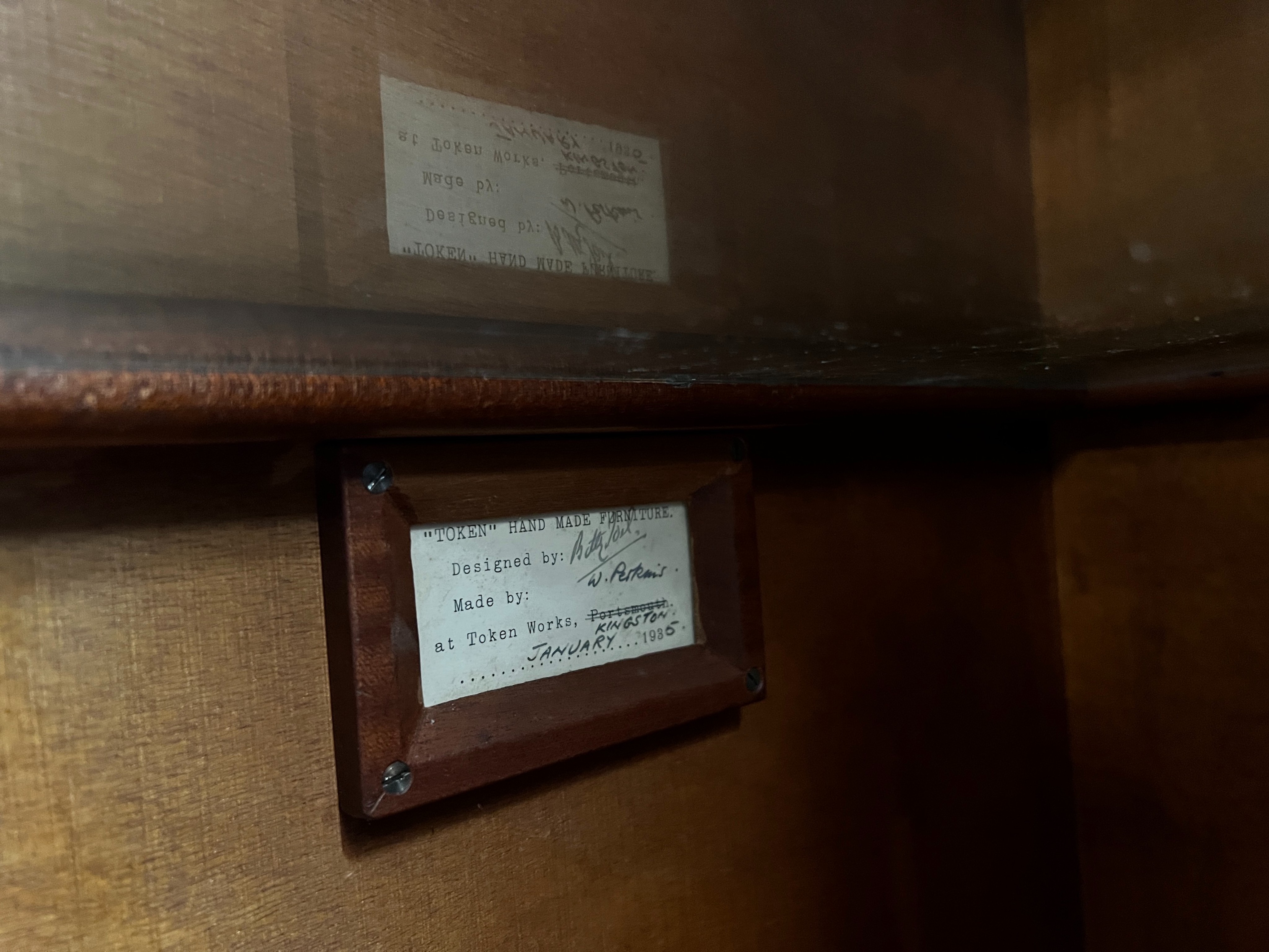 A Betty Joel Token furniture D shaped sideboard, the interior label dated January 1935, width 142cm, depth 46cm, height 82cm